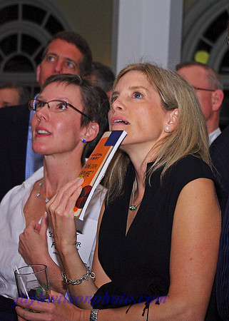 Andrea Bates (left) and Tammy Cushman contemplate the bids